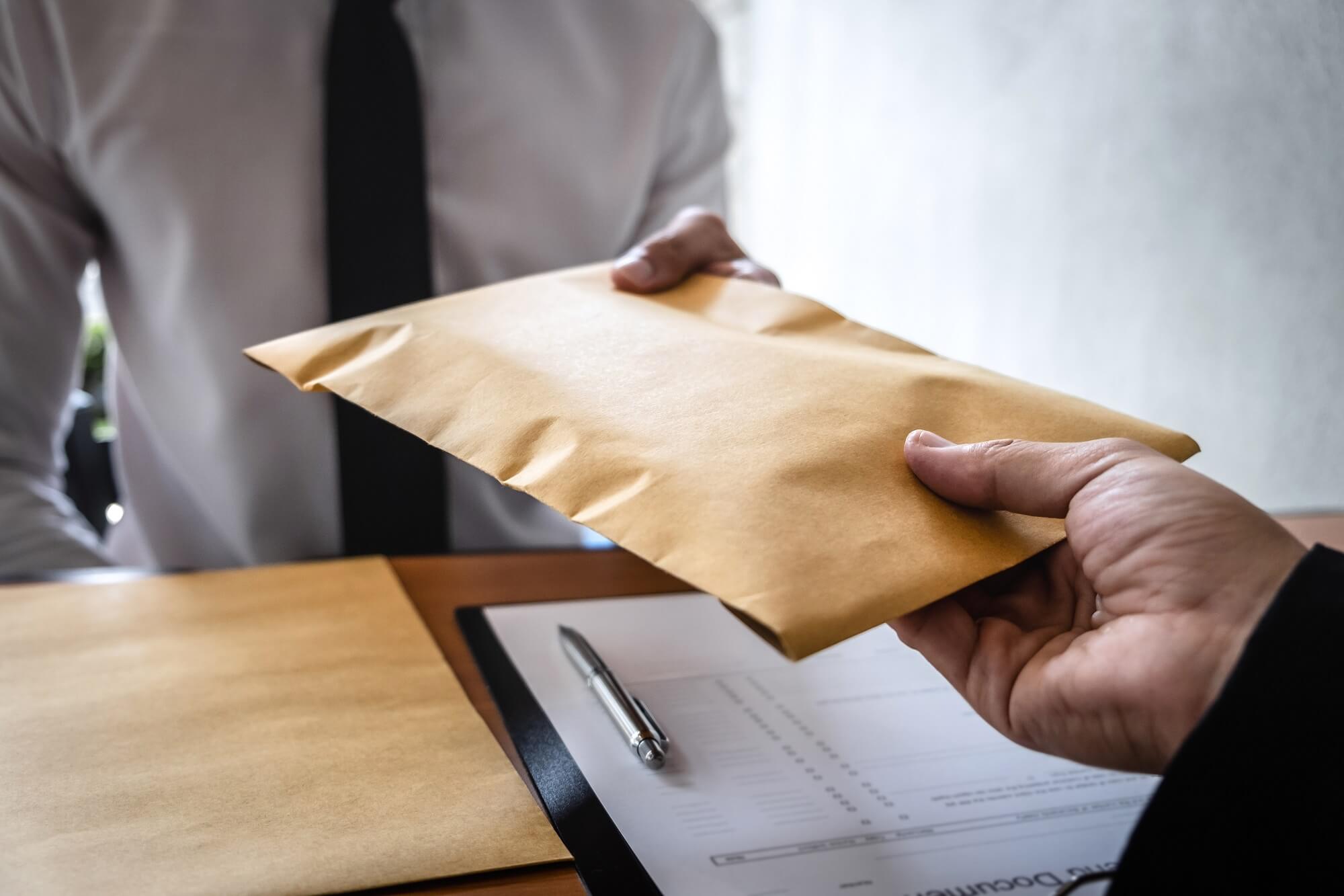 The husband is served with a package of divorce documents from his wife